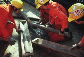 Figure 15: team of BP sedimentologists recovering core of Forties Formation reservoir on the deck of Forties Delta on 17 May 1982. Photograph by Chief Sedimentologist (the author).